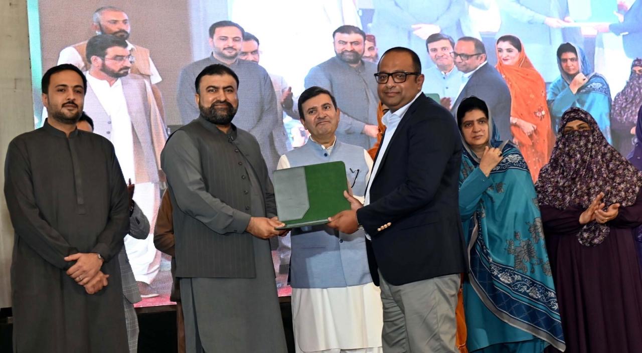 CM Balochistan handing over a certificate to one of the partner companies members for youth skill development program